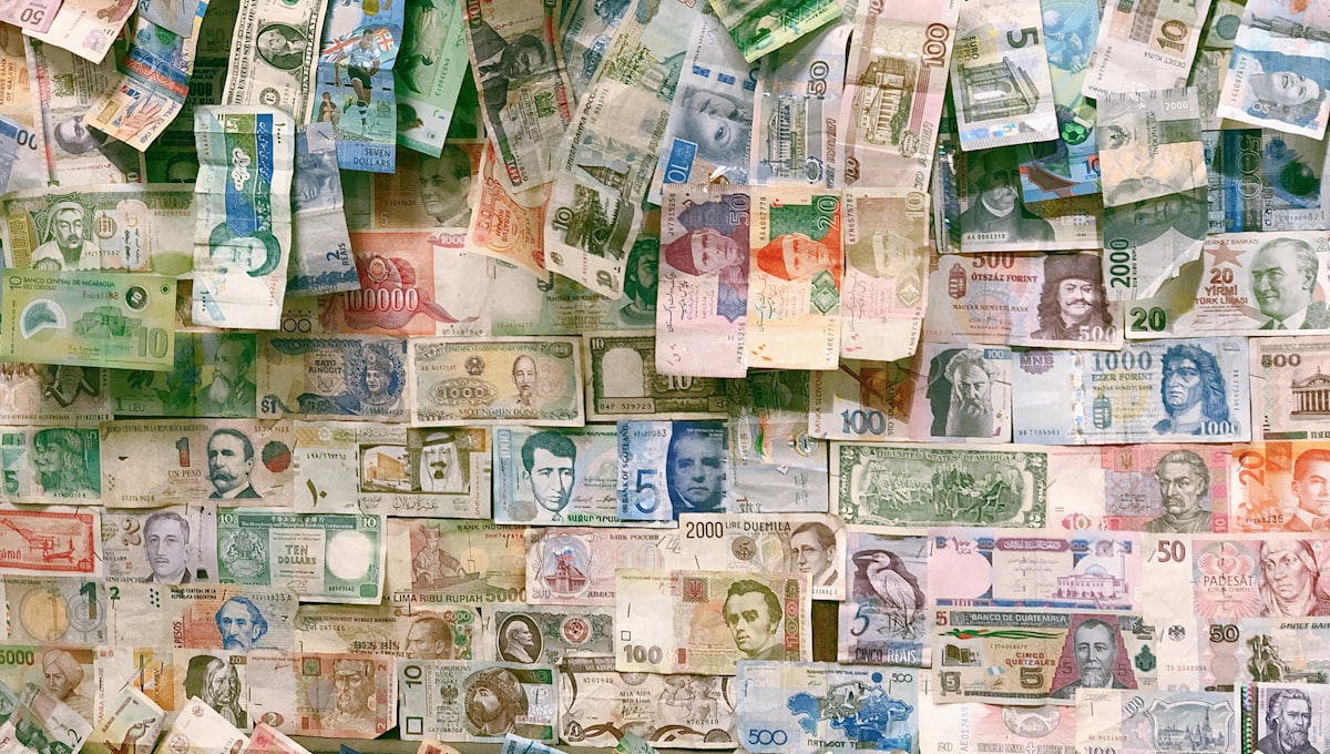 Currency exchange board showing multiple currency rates at an international airport