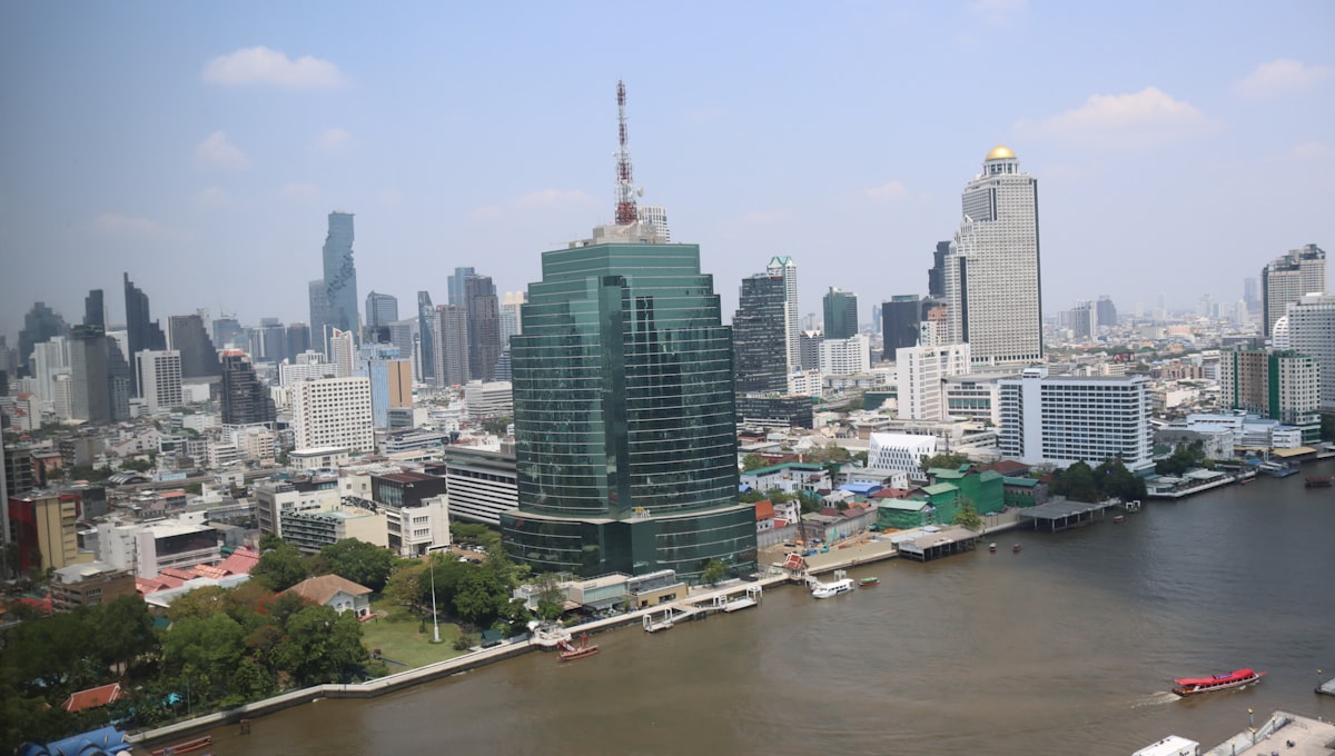 a large body of water with a city in the background