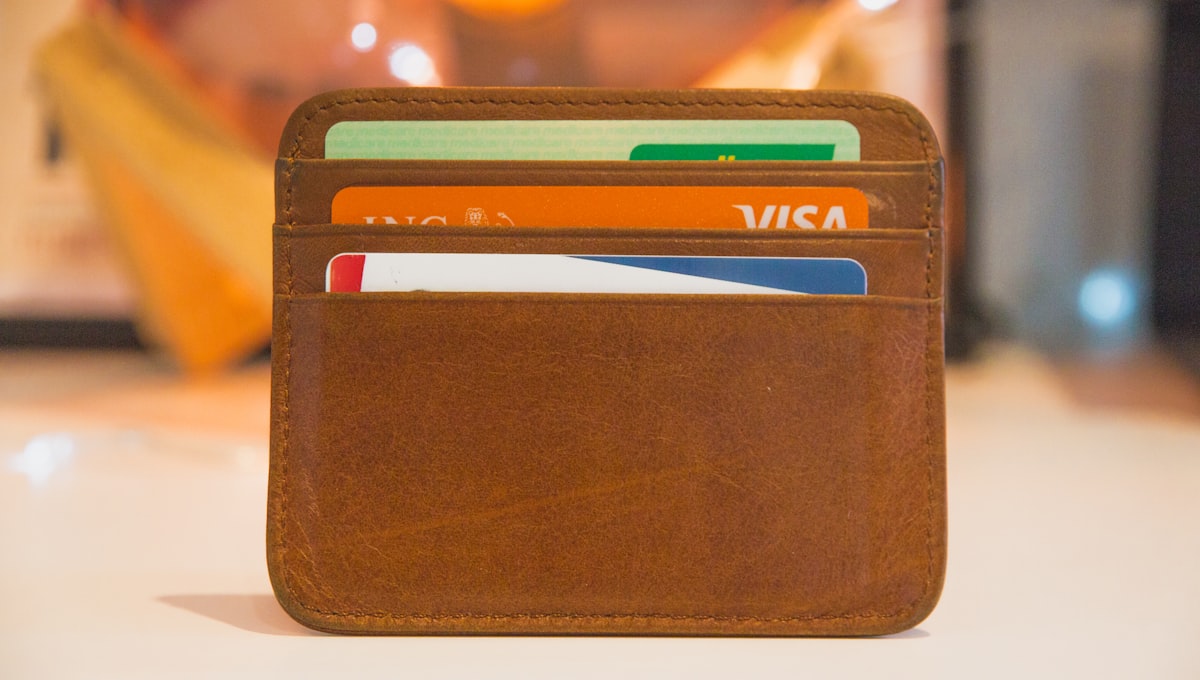 Airport lounge entrance with credit card access sign