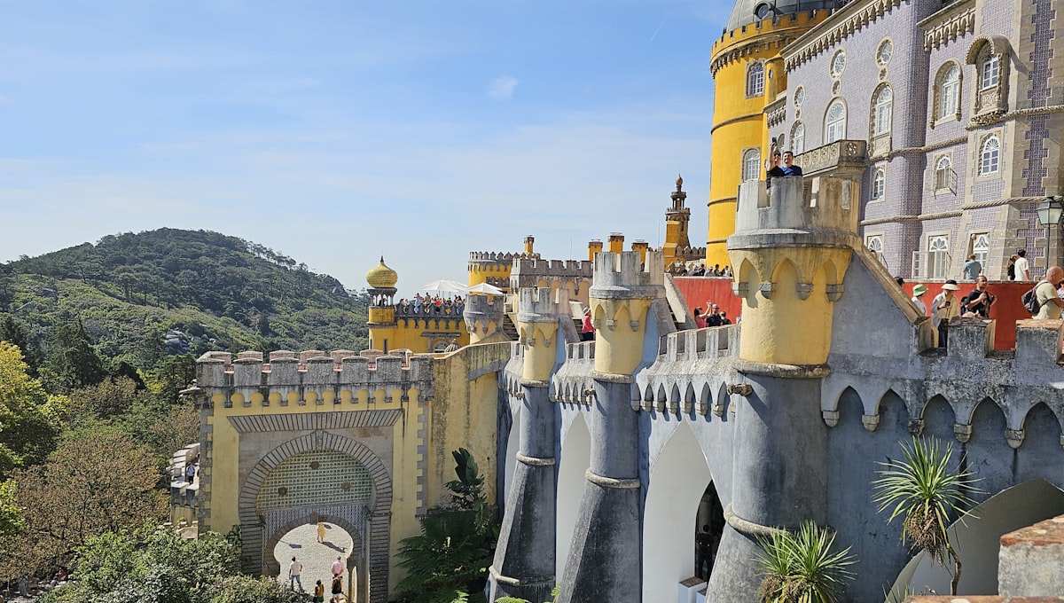 The colourful turrets of the Palácio da Pena rising above the forest canopy in Sintra