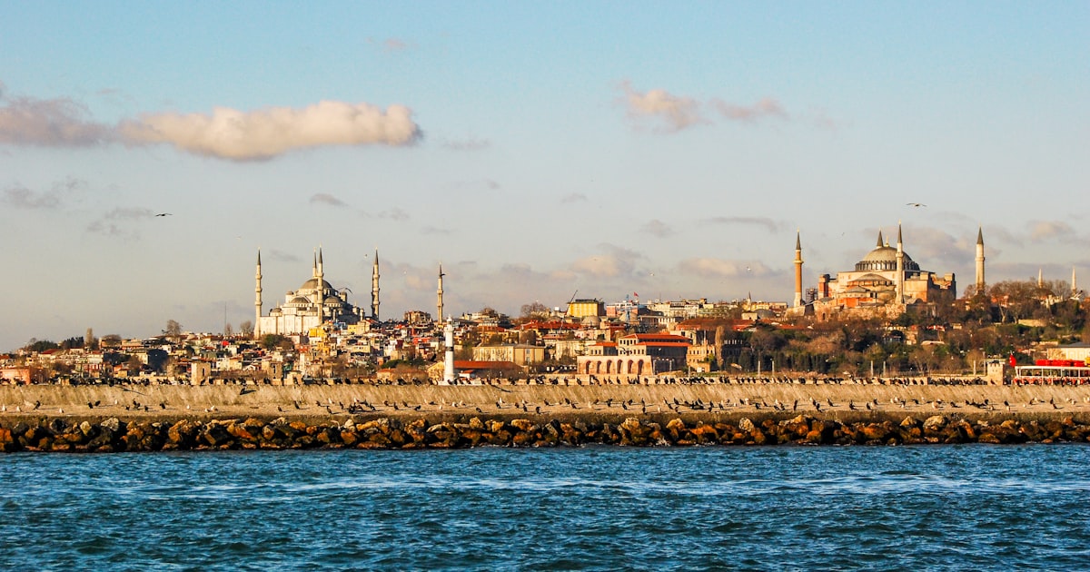 city skyline near body of water during daytime